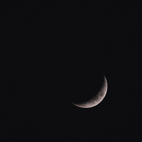 Photograph of Waxing Crescent Moon by Alex Nichol